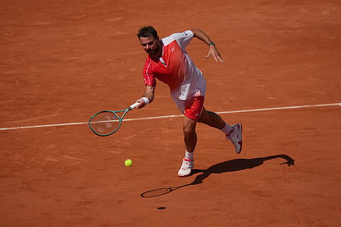 Stan Wawrinka of Switzerland returns to Jesper De Jong of the Netherlands during their first round men's singles tennis match at the French Open tennis tournament in Paris.