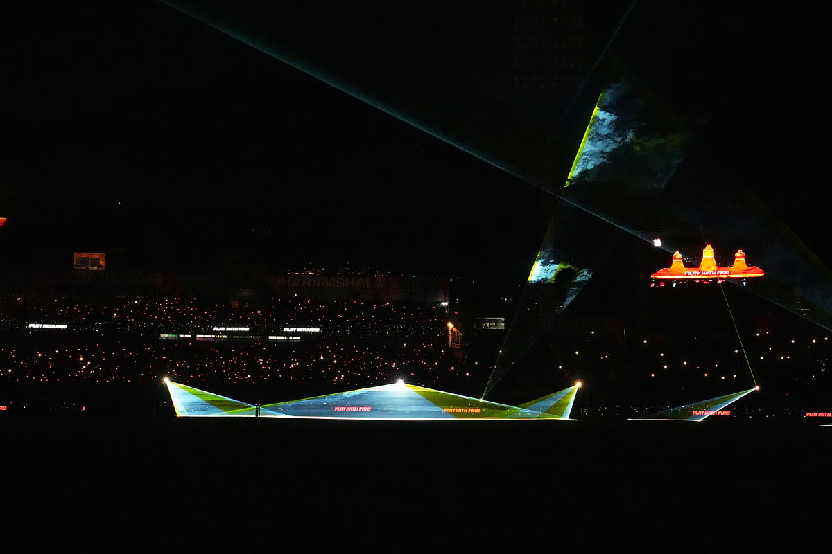 A laser light show takes place during an innings break in the Indian Premier League cricket match between Gujarat Titans and Royal Challengers Bengaluru in Dharamshala, India.
