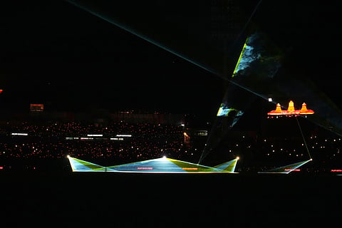 A laser light show takes place during an innings break in the Indian Premier League cricket match between Gujarat Titans and Royal Challengers Bengaluru in Dharamshala, India.