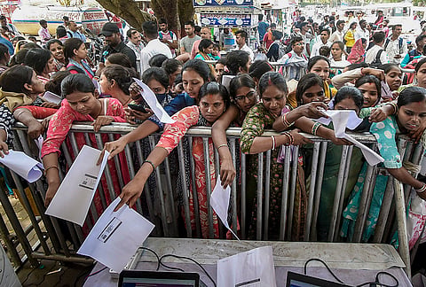 Women job seekers gather at the registration counter during the second day of the State-Level Job Fair 2026 at Gyan Bhawan, in Patna, Bihar.