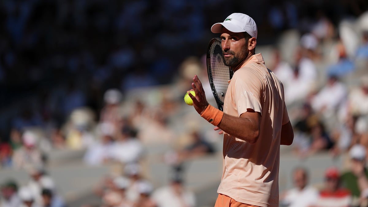 Novak Djokovic of Serbia reacts as he plays against Valentin Royer of France during their second round men's singles tennis match at the French Open tennis tournament in Paris. - AP