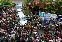 Violence Erupts Outside Ex-Kerala CM Vijayan’s House During ED Raid | Photo: PTI : LDF activists attack the vehicle carrying Enforcement Directorate (ED) officials after ED conducted a raid at former Kerala Chief Minister Pinarayi Vijayan’s residence as part of its investigation in the CMRL money laundering case, in Thiruvananthapuram.