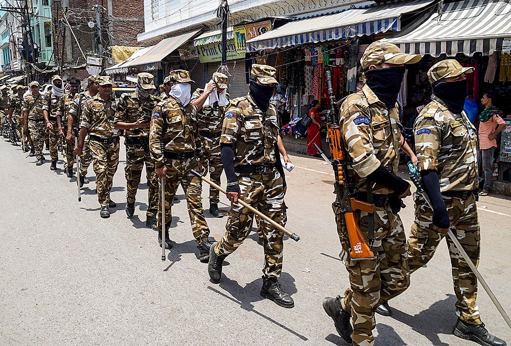 Security personnel flag march ahead of Bakri Eid