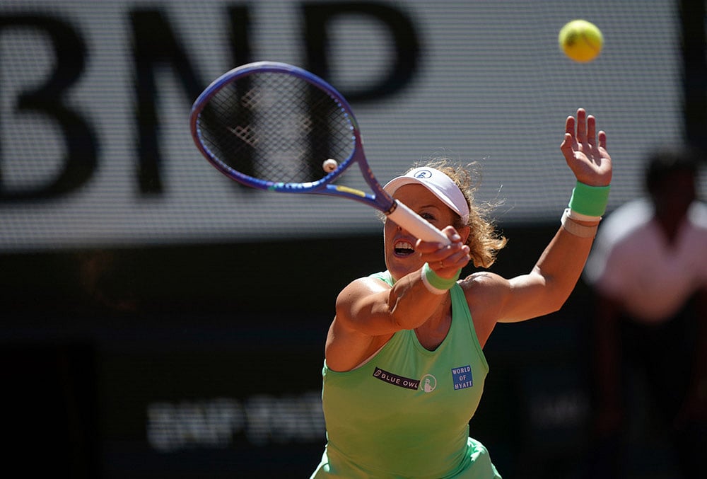 Laura Siegemund of Germany returns to Naomi Osaka of Japan during their first round womens singles tennis match at the French Open tennis tournament in Paris.