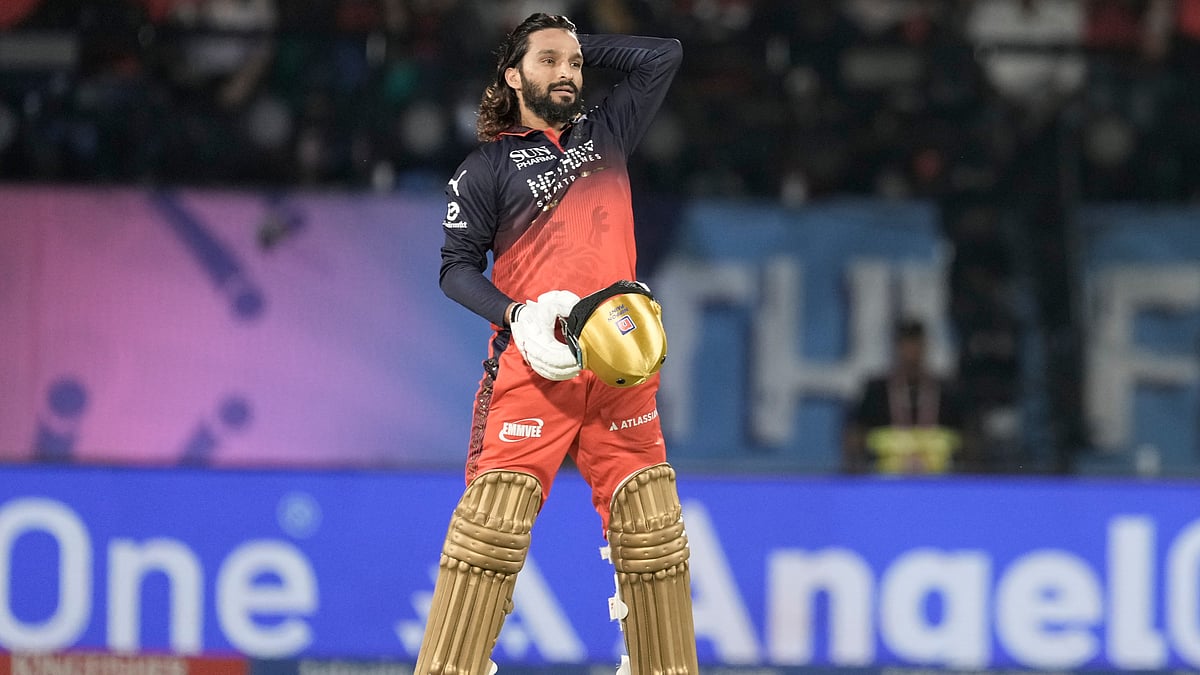 Royal Challengers Bengaluru's captain Rajat Patidar reacts after hitting a six during the Indian Premier League cricket match between Gujarat Titans and Royal Challengers Bengaluru in Dharamshala, India, Tuesday, May 26, 2026 - (AP Photo/Ashwini Bhatia)