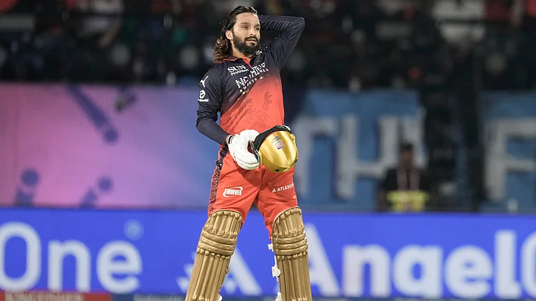 Royal Challengers Bengaluru's captain Rajat Patidar reacts after hitting a six during the Indian Premier League cricket match between Gujarat Titans and Royal Challengers Bengaluru in Dharamshala, India, Tuesday, May 26, 2026 - (AP Photo/Ashwini Bhatia)