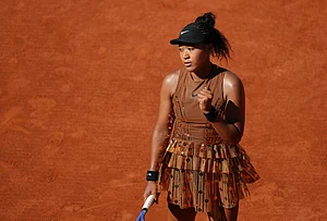 | Photo: AP/Aurelien Morissard : Naomi Osaka of Japan celebrates as she plays against Laura Siegemund of Germany during their first round women's singles tennis match at the French Open tennis tournament in Paris.