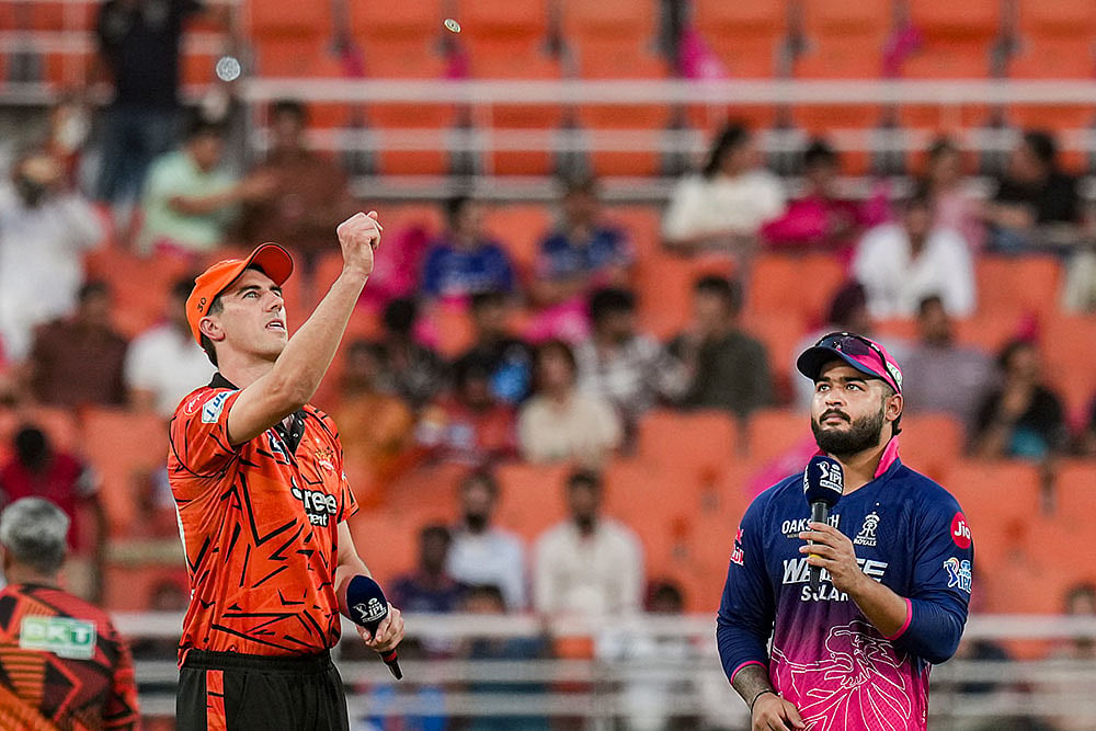Rajasthan Royals' captain Riyan Parag, right, and Sunrisers Hyderabad's captain Pat Cummins during the toss before the Indian Premier League (IPL) 2026 T20 Eliminator cricket match between Rajasthan Royals and Sunrisers Hyderabad, in New Chandigarh. SRH chose to field.  - | Photo: PTI/Karma Bhutia