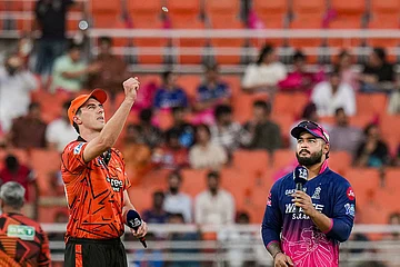 | Photo: PTI/Karma Bhutia : Rajasthan Royals' captain Riyan Parag, right, and Sunrisers Hyderabad's captain Pat Cummins during the toss before the Indian Premier League (IPL) 2026 T20 Eliminator cricket match between Rajasthan Royals and Sunrisers Hyderabad, in New Chandigarh. SRH chose to field.