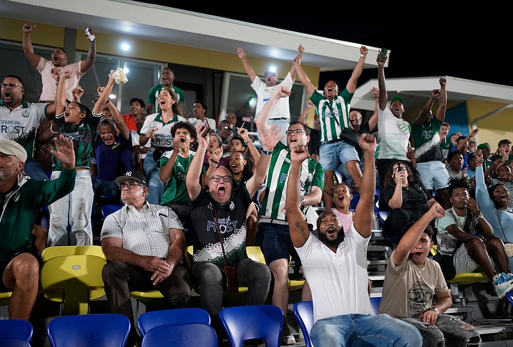 Fans of Inter Willemstad cheer during a Curacao soccer league match against Centro Dominguito in Willemstad, Curacao.