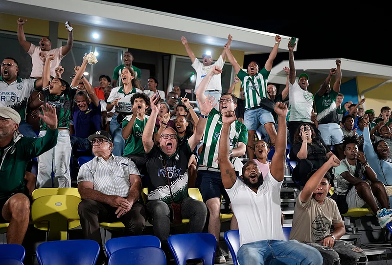 Fans of Inter Willemstad cheer during a Curacao soccer league match against Centro Dominguito in Willemstad, Curacao.