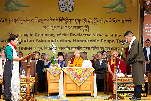 Tibetan Supreme Justice Commission (TSJC) Chief Justice Commissioner Yeshi Wangmo administers the oath of office to Penpa Tsering who has been re-elected as the Sikyong of the Central Tibetan Administration for his second five-year term in the presence of spiritual leader 14th Dalai Lama during the swearing-in ceremony, in Dharamshala, Himachal Pradesh.