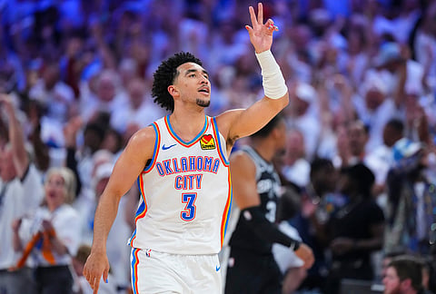 Oklahoma City Thunder guard Jared McCain (3) celebrates a three-point basket against the San Antonio Spurs in the second half of Game 5 in the Western Conference finals NBA basketball playoffs series, in Oklahoma City.