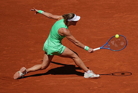 Laura Siegemund of Germany returns to Naomi Osaka of Japan during their first round women's singles tennis match at the French Open tennis tournament in Paris.