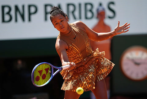Naomi Osaka of Japan warms up before the first round women's singles tennis match against Laura Siegemund of Germany at the French Open tennis tournament in Paris.