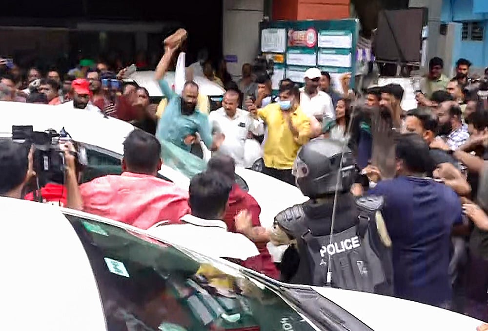 LDF activists attack ED vehicle after raid at Vijayans residence