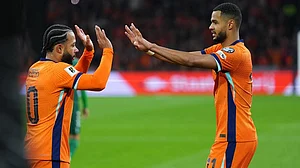 | Photo: AP/Peter Dejong : Netherlands' Cody Gakpo is congratulated by Memphis Depay after scoring his side's 2nd goal from the penalty spot during a World Cup 2026 group G qualifying soccer match between Netherlands and Lithuania in Amsterdam, Netherlands.