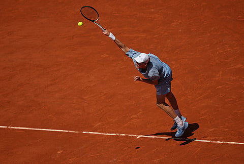 Jannik Sinner of Italy serves to Juan Manuel Cerundolo of Argentina during their second round men's singles tennis match at the French Open tennis tournament in Paris.
