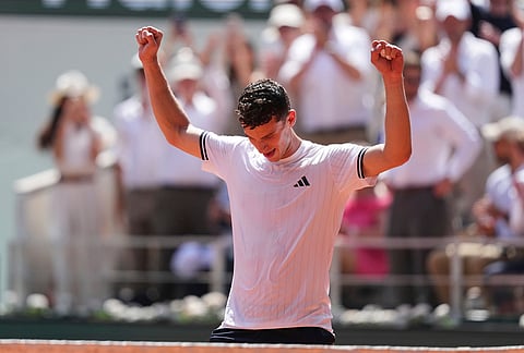 Juan Manuel Cerundolo of Argentina celebrates winning against Jannik Sinner of Italy after their second round men's singles tennis match at the French Open tennis tournament in Paris.