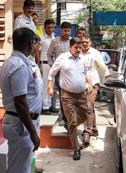 Enforcement Directorate officials produce Kolkata Police DCP Shantanu Sinha Biswas at a city court in connection with a money laundering case, in Kolkata.