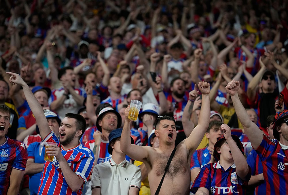 Crystal Palace fans celebrate during the Europa Conference League final soccer match between Crystal Palace and Rayo Vallecano in Leipzig, Germany.