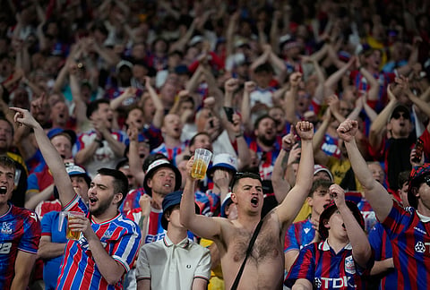 Crystal Palace fans celebrate during the Europa Conference League final soccer match between Crystal Palace and Rayo Vallecano in Leipzig, Germany.