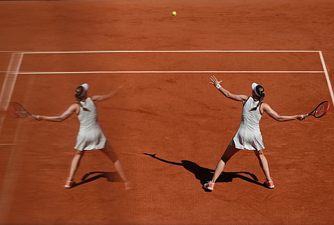 Elena Rybakina of Kazakhstan returns to Yuliia Starodubtseva of Ukraine during their second round women's singles tennis match at the French Open tennis tournament in Paris.