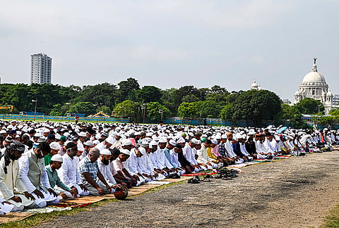 People offer prayers on the occasion of Eid al-Adha at Brigade Parade Ground, in Kolkata.