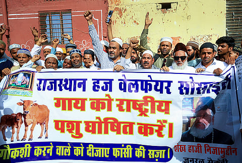 Rajasthan Haj Welfare Society General Secretary Sheikh Haji Nizamuddin along with members stage a protest demanding cow to be declared as 'national animal', outside the Eigah Mosque, in Jaipur.