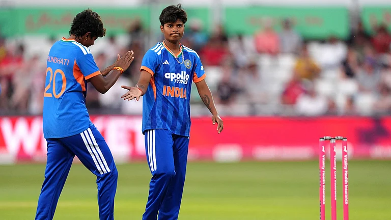 India's Arundhati Reddy (20) and Kranti Gaud celebrate the wicket of England's Sophia Dunkley during the first Vitality IT20 cricket match. - AP Photo