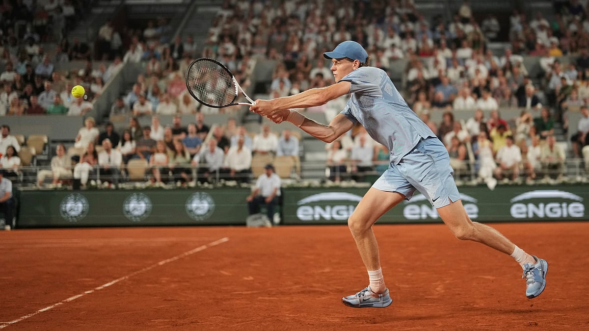 Jannik Sinner of Italy returns to Clement Tabur of France during their first round men's singles tennis match at the French Open tennis tournament in Paris, Tuesday, May 26, 2026. - (AP Photo/Thibault Camus)