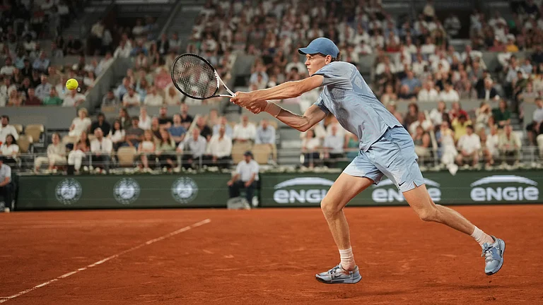 Jannik Sinner of Italy returns to Clement Tabur of France during their first round men's singles tennis match at the French Open tennis tournament in Paris, Tuesday, May 26, 2026. - (AP Photo/Thibault Camus)