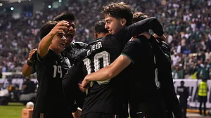 AP Photo : Mexico's Brian Gutiérrez, right, is congratulated after scoring his side's opening goal against Ghana during an international friendly soccer match in Puebla, Mexico.