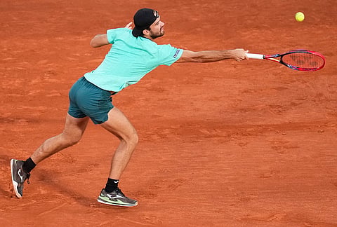Tomas Machac of the Czech Republic returns to Alexander Zverev of Germany during their second round men's singles tennis match at the French Open tennis tournament in Paris.