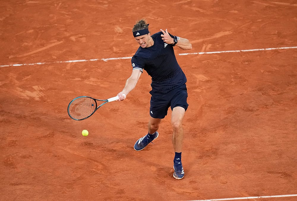 Alexander Zverev of Germany returns to Tomas Machac of the Czech Republic during their second round mens singles tennis match at the French Open tennis tournament in Paris.