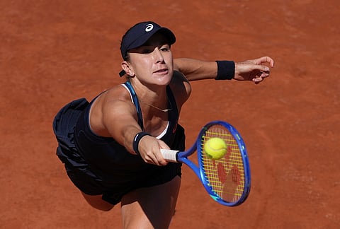 Belinda Bencic of Switzerland returns to Caty Mcnally of the U.S. during their second round women's singles tennis match at the French Open tennis tournament in Paris.