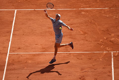 Jannik Sinner of Italy returns to Juan Manuel Cerundolo of Argentina during their second round men's singles tennis match at the French Open tennis tournament in Paris.