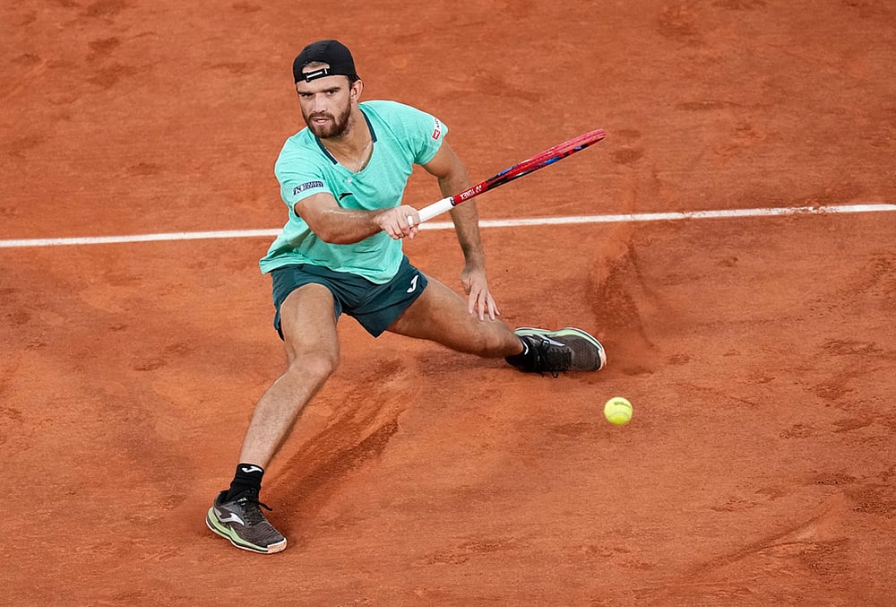 Tomas Machac of the Czech Republic returns to Alexander Zverev of Germany during their second round mens singles tennis match at the French Open tennis tournament in Paris.