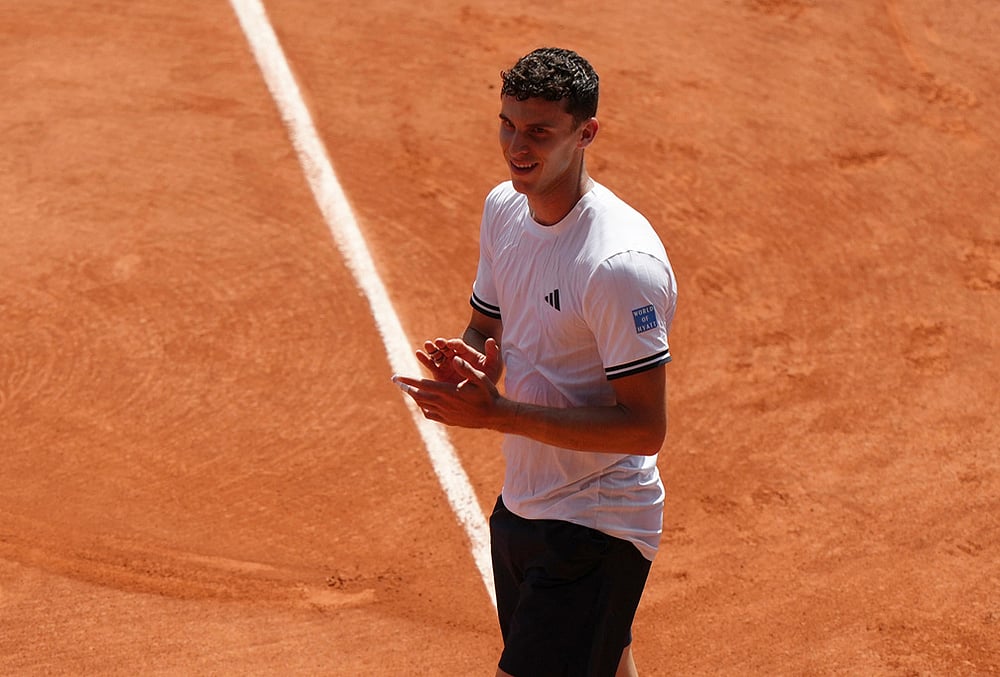 Juan Manuel Cerundolo of Argentina celebrates winning against Jannik Sinner of Italy after their second round men's singles tennis match at the French Open tennis tournament in Paris. - | Photo: AP/Aurelien Morissard