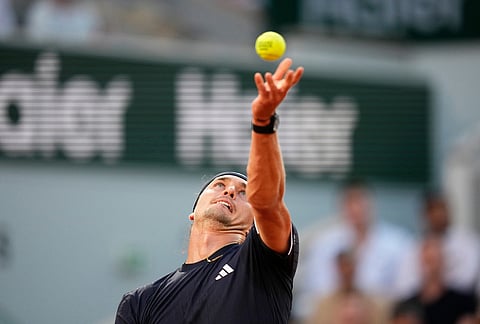 Alexander Zverev of Germany serves to Tomas Machac of the Czech Republic during their second round men's singles tennis match at the French Open tennis tournament in Paris.