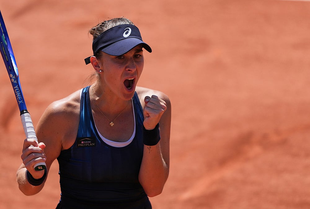 Belinda Bencic of Switzerland celebarates after winning against Caty Mcnally of the U.S. during their second round women's singles tennis match at the French Open tennis tournament in Paris. - | Photo: AP/Thibault Camus