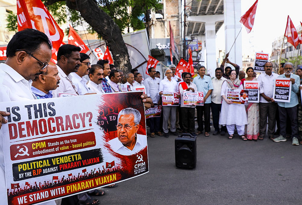 CPI(M) protest against ED raid at Vijayans residences