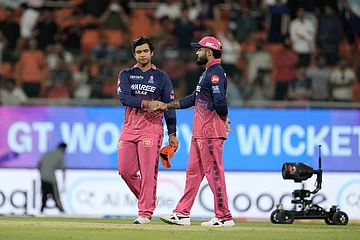 | Photo: AP/Ashwini Bhatia : Rajasthan Royals' Vaibhav Sooryavanshi shakes hand with his captain Riyan Parag after Gujarat Titans won against Rajasthan Royals during the Indian Premier League cricket match in New Chandigarh, India.