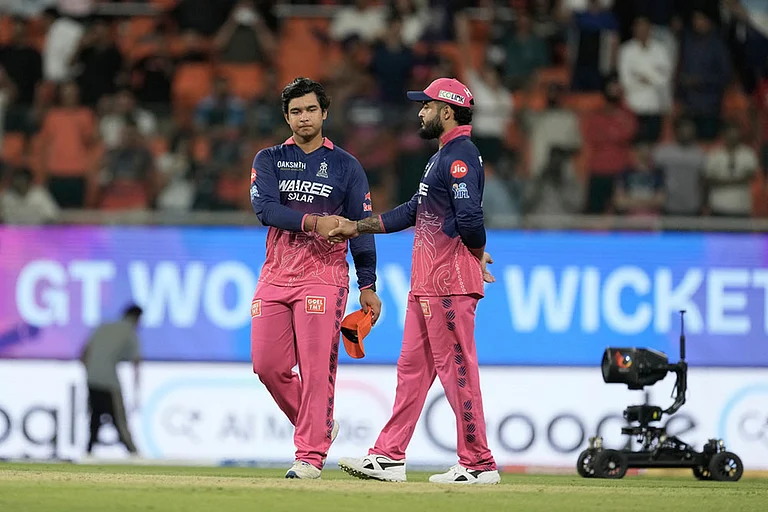 Rajasthan Royals' Vaibhav Sooryavanshi shakes hand with his captain Riyan Parag after Gujarat Titans won against Rajasthan Royals during the Indian Premier League cricket match in New Chandigarh, India. - | Photo: AP/Ashwini Bhatia