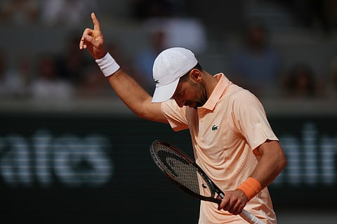 Novak Djokovic of Serbia gestures as he plays against Joao Fonseca of Brazil during their third round men's singles tennis match at the French Open tennis tournament in Paris, Friday, May 29, 2026. 