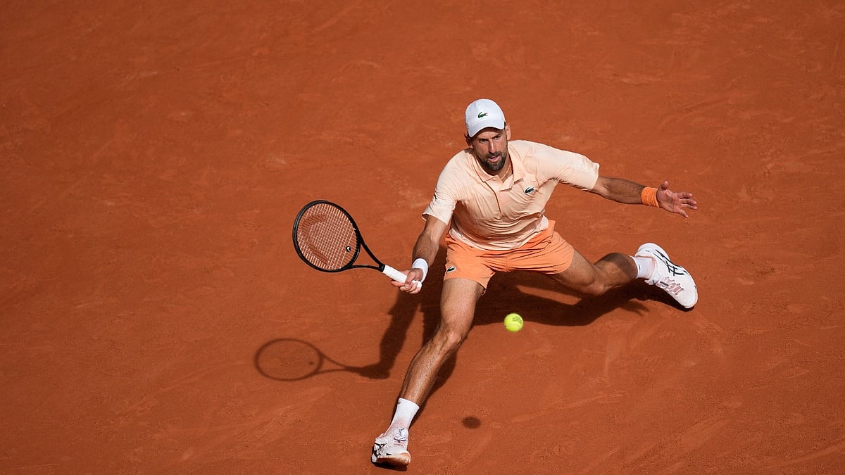 Novak Djokovic of Serbia returns to Joao Fonseca of Brazil during their third round men's singles tennis match at the French Open tennis tournament in Paris, Friday, May 29, 2026. - (AP Photo/Christophe Ena)