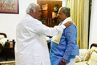 | Photo: Handout via PTI : Congress President and Rajya Sabha LoP Mallikarjun Kharge with party leader Siddaramaiah during a meeting after the latter stepped down from the post of Karnataka Chief Minister, in New Delhi. 