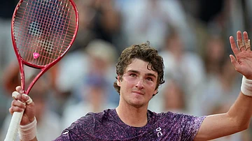 (AP Photo/Christophe Ena) : Joao Fonseca of Brazil celebrates winning the third round men's singles tennis match against Novak Djokovic of Serbia at the French Open tennis tournament in Paris, Friday, May 29, 2026.