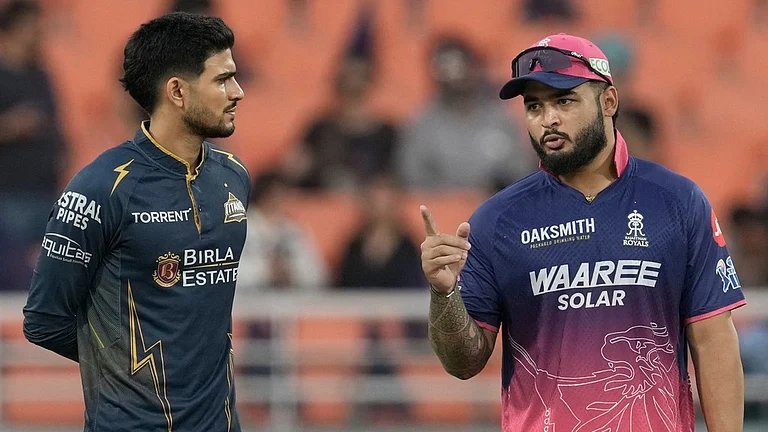 Gujarat Titans' captain Shubman Gill and Rajasthan Royals' captain Riyan Parag, right, talk before the toss during the Indian Premier League cricket match between Gujarat Titans and Rajasthan Royals in New Chandigarh, India, Friday, May 29, 2026. - AP Photo/shwini Bhatia