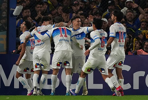 Clemente Montes of Chile's Universidad Catolica (11), celebrates with teammates after scoring his side's opening goal against Argentina's Boca Juniors during a Copa Libertadores Group D soccer match in Buenos Aires, Argentina.